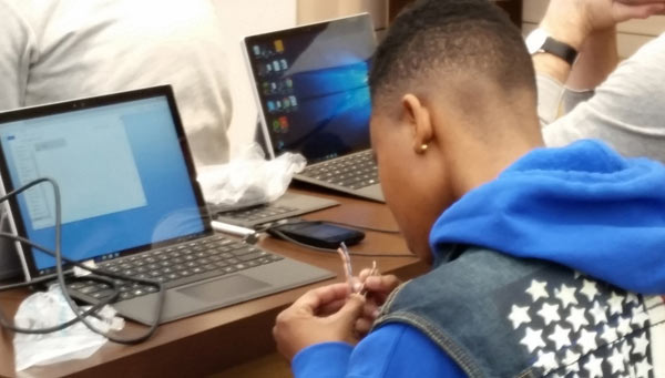 Techie Youth student crimping a CAT5 networking cable